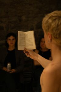 Engaging poetry reading session with close audience interaction in a warm, cozy ambiance.